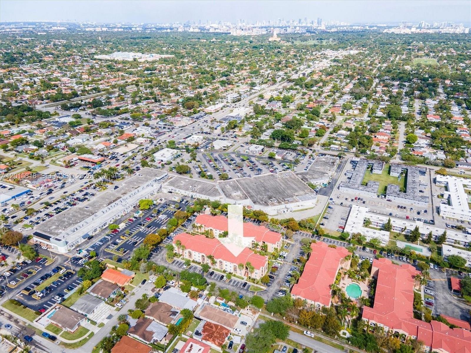 An aerial view shows a multi-story residential complex with red roofs and surrounding parking lots — 6861 SW 44th St # 109, Miami FL 33155, MIAMI, FL