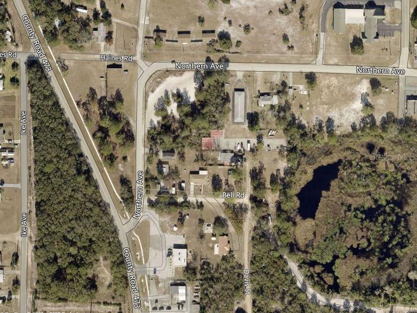 This is an aerial map view of a rural intersection with several buildings and roads — NORTHERN AVENUE, LEESBURG, FL