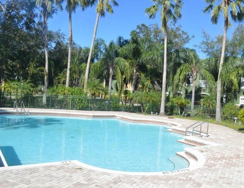 A parking space marked 408 is situated in front of a multi-story residential building — 4360 S KIRKMAN ROAD UNIT 408, ORLANDO, FL