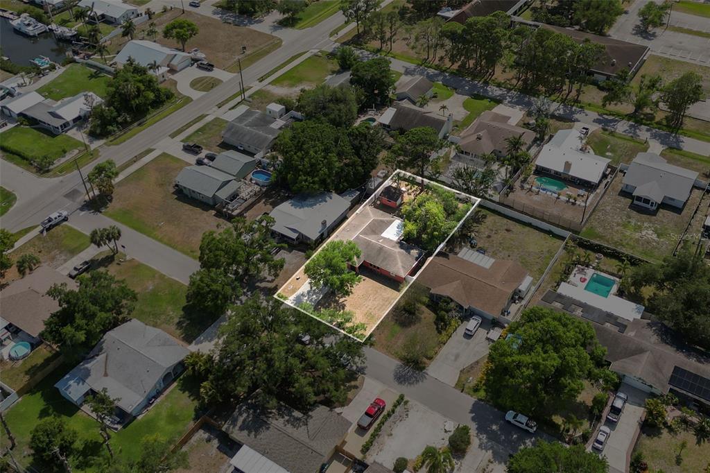 A single-story house with a coral-colored exterior, a garage, and an arched front entryway — 1007 22ND AVENUE W, PALMETTO, FL