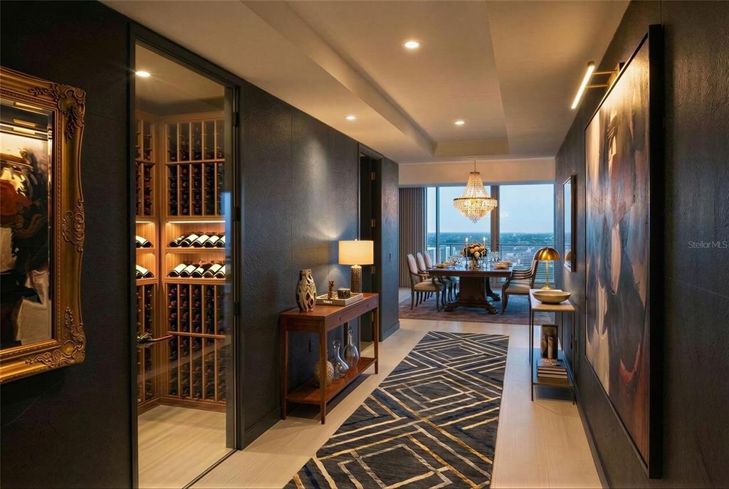 A hallway with a wine cellar, geometric rug, and dining room visible in the background — 400 CENTRAL AVENUE UNIT 2001, ST PETERSBURG, FL