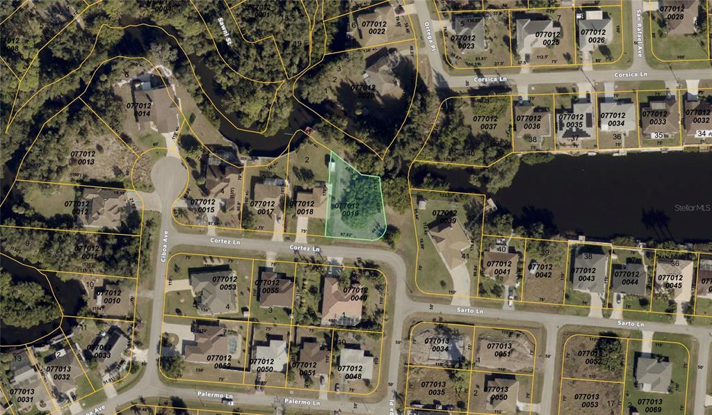 This image is a map showing a residential neighborhood with a highlighted vacant lot — CORTEZ LANE, NORTH PORT, FL