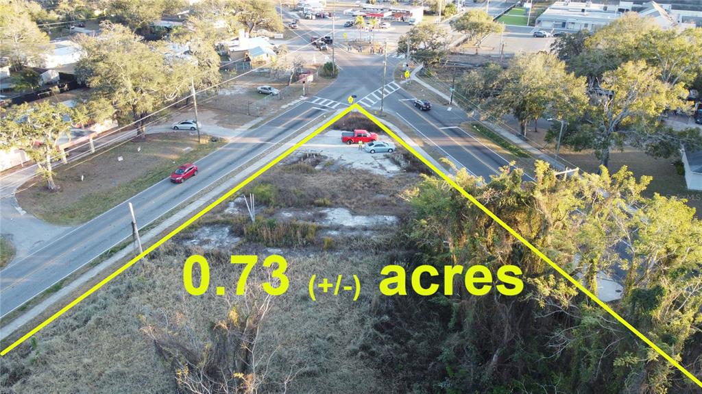 An aerial view shows a triangular vacant lot bordered by two roads — 535 MAYDELL DRIVE, TAMPA, FL