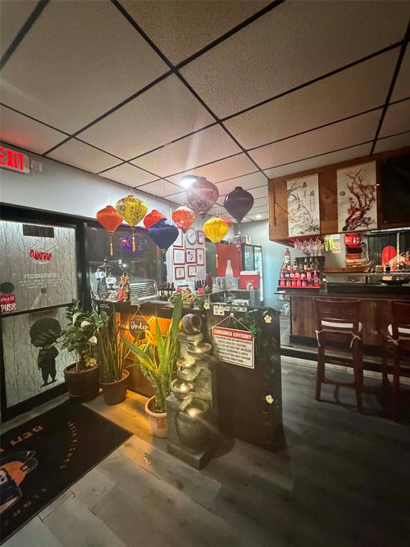 This restaurant interior features a service counter, hanging paper lanterns, and a small water fountain — 8256 ULMERTON ROAD, LARGO, FL