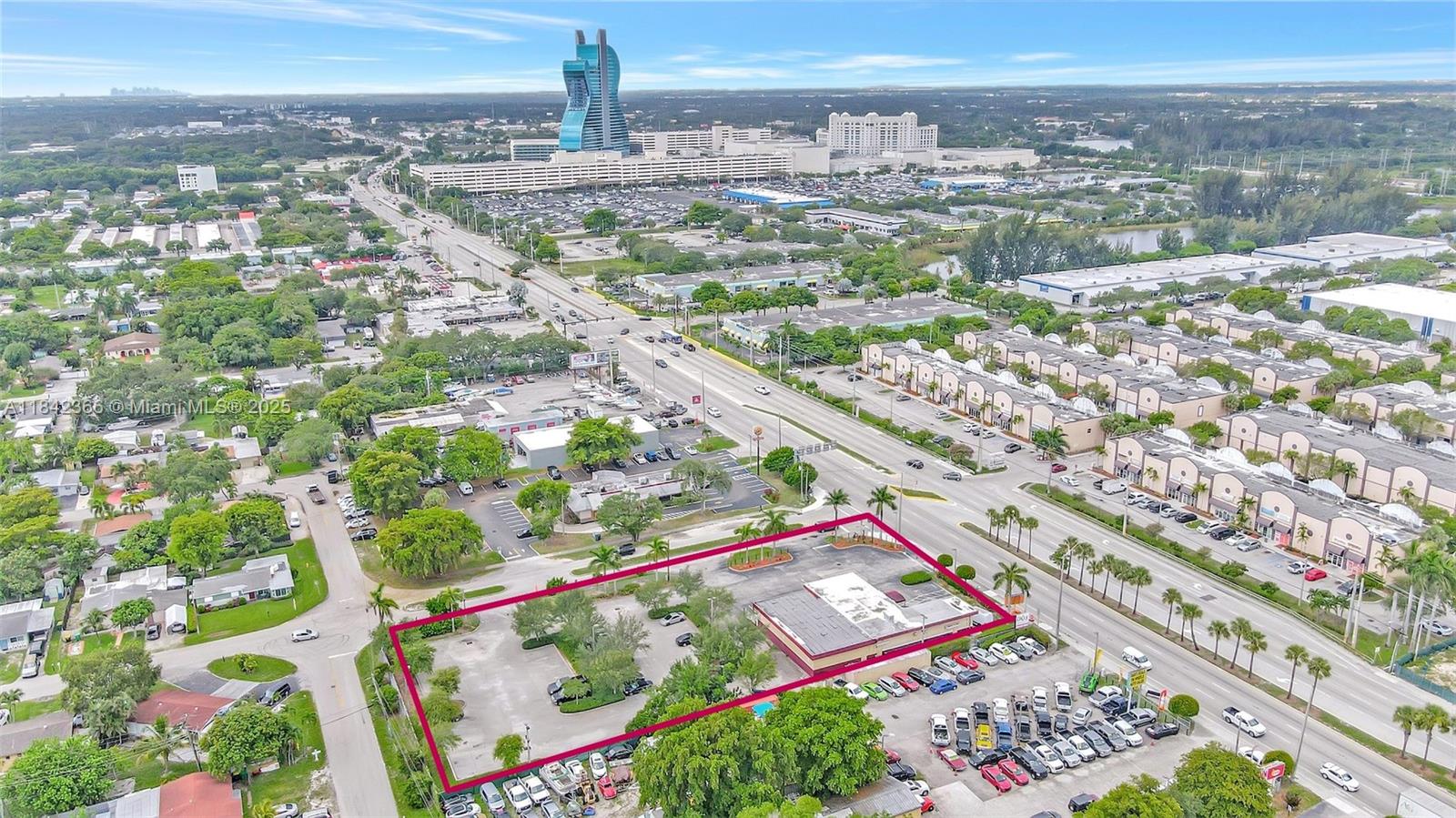 An aerial view shows a commercial property with a parking lot and building outlined in red — 4950 S State Road 7, Hollywood FL 33314, HOLLYWOOD, FL