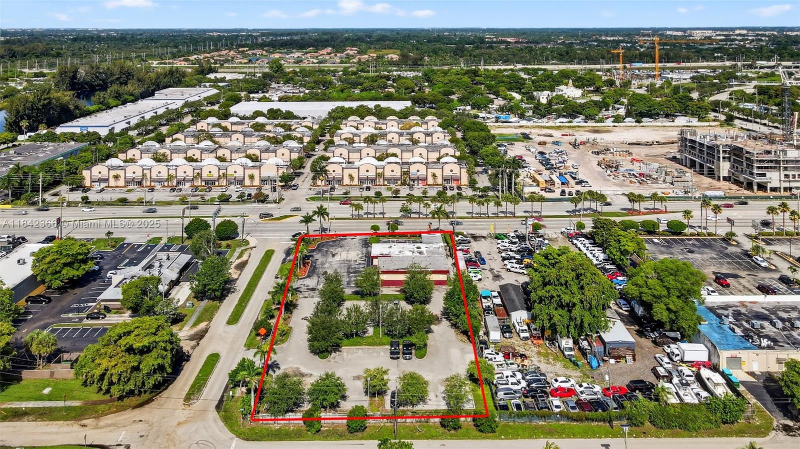 An aerial view shows a rectangular commercial lot with a building and parking area — 4950 S State Road 7, Hollywood FL 33314, HOLLYWOOD, FL