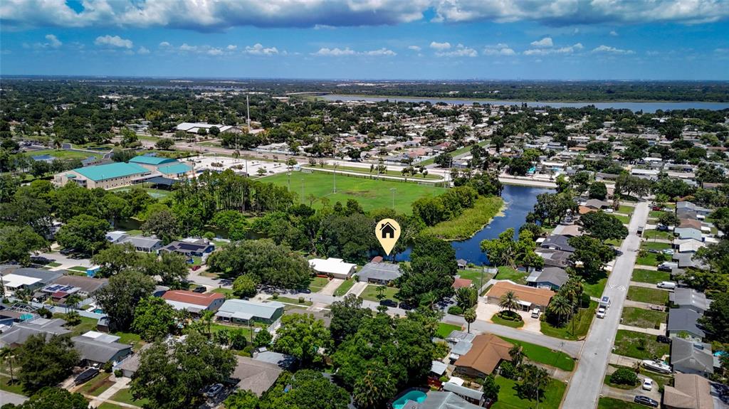 An aerial view shows a residential neighborhood with a house marked by a location pin — 8879 LAKEWOOD DRIVE, SEMINOLE, FL