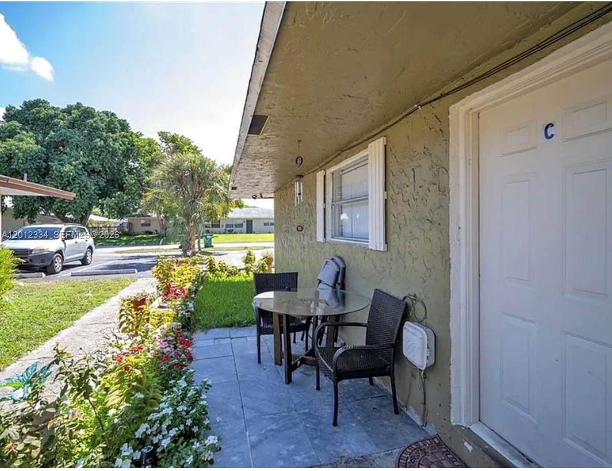 A single-story building with a flat roof and a parking lot in front — 581 Kathy Ln # D, Margate FL 33068, MARGATE, FL