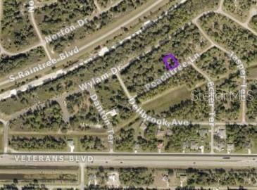 An aerial map shows a highlighted vacant lot located near a residential street intersection — LOT 15 PEACHTREE LANE, NORTH PORT, FL