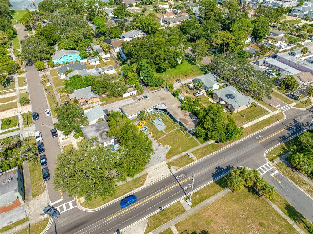 An aerial view shows a commercial building with a parking lot next to a road — 1770 N FORT HARRISON AVENUE, CLEARWATER, FL