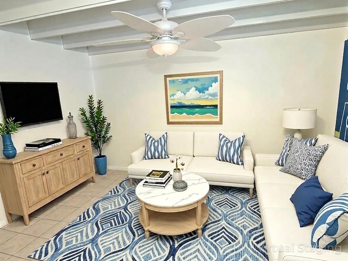 A living room features a white sofa, a marble coffee table, and a blue patterned rug — 702 N Federal Highway # A8, FL 33460, FL