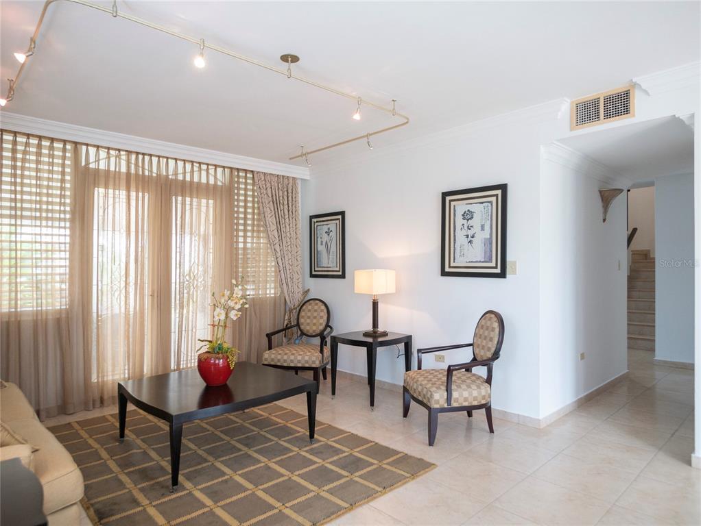 A living room features tile floors, a coffee table, two chairs, and track lighting — #639 DON DIEGO, SAN JUAN, PR