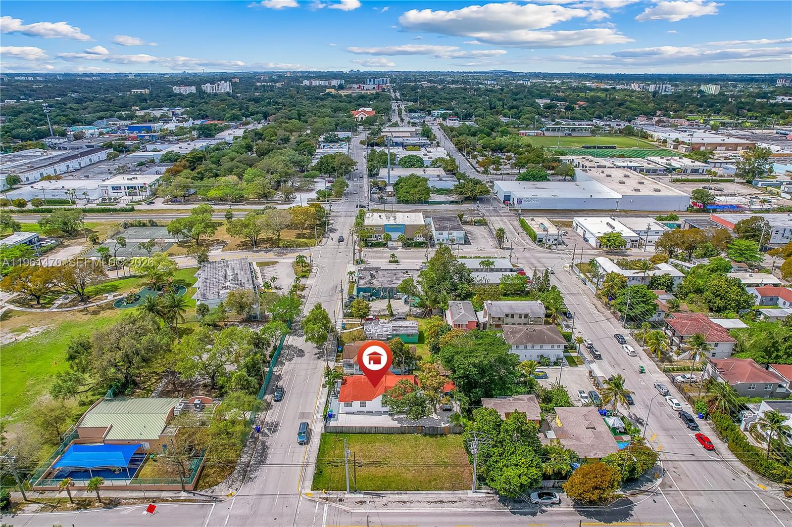 An aerial view shows a residential property marked with a pin amidst a suburban neighborhood — 473 NE 61st St, Miami FL 33137, MIAMI, FL