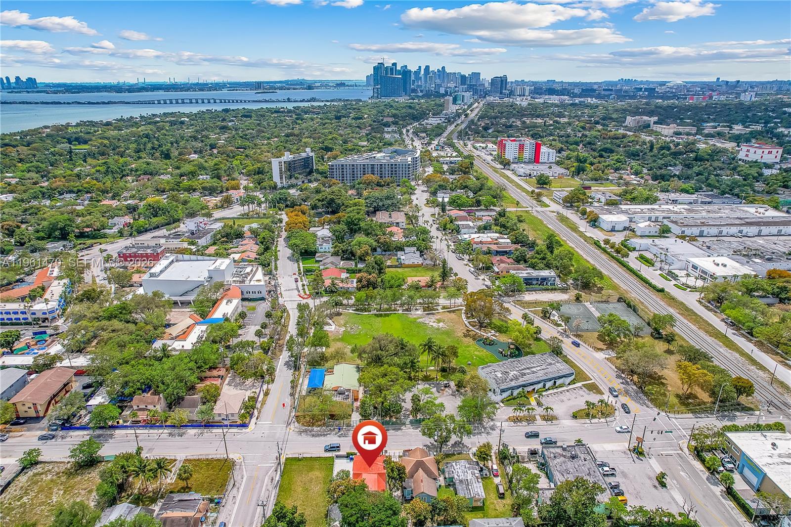 An aerial view shows a residential property marked with a red icon near a park — 473 NE 61st St, Miami FL 33137, MIAMI, FL