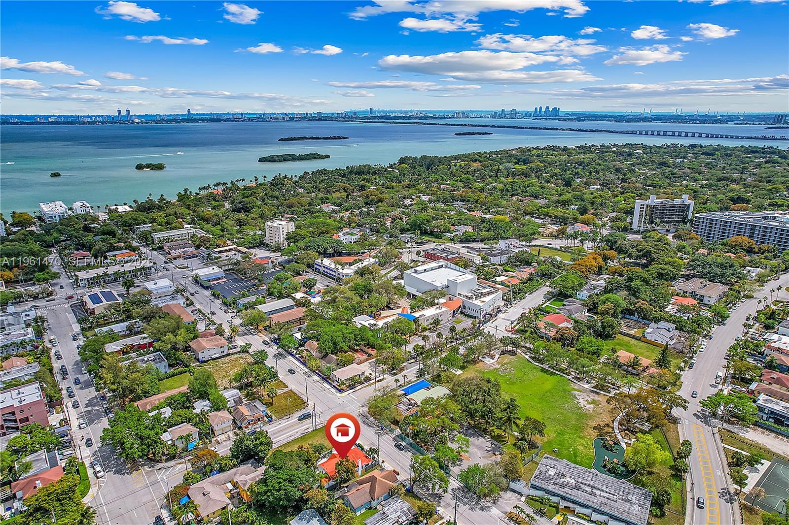 An aerial view shows a residential property marked with a pin in a coastal neighborhood — 473 NE 61st St, Miami FL 33137, MIAMI, FL