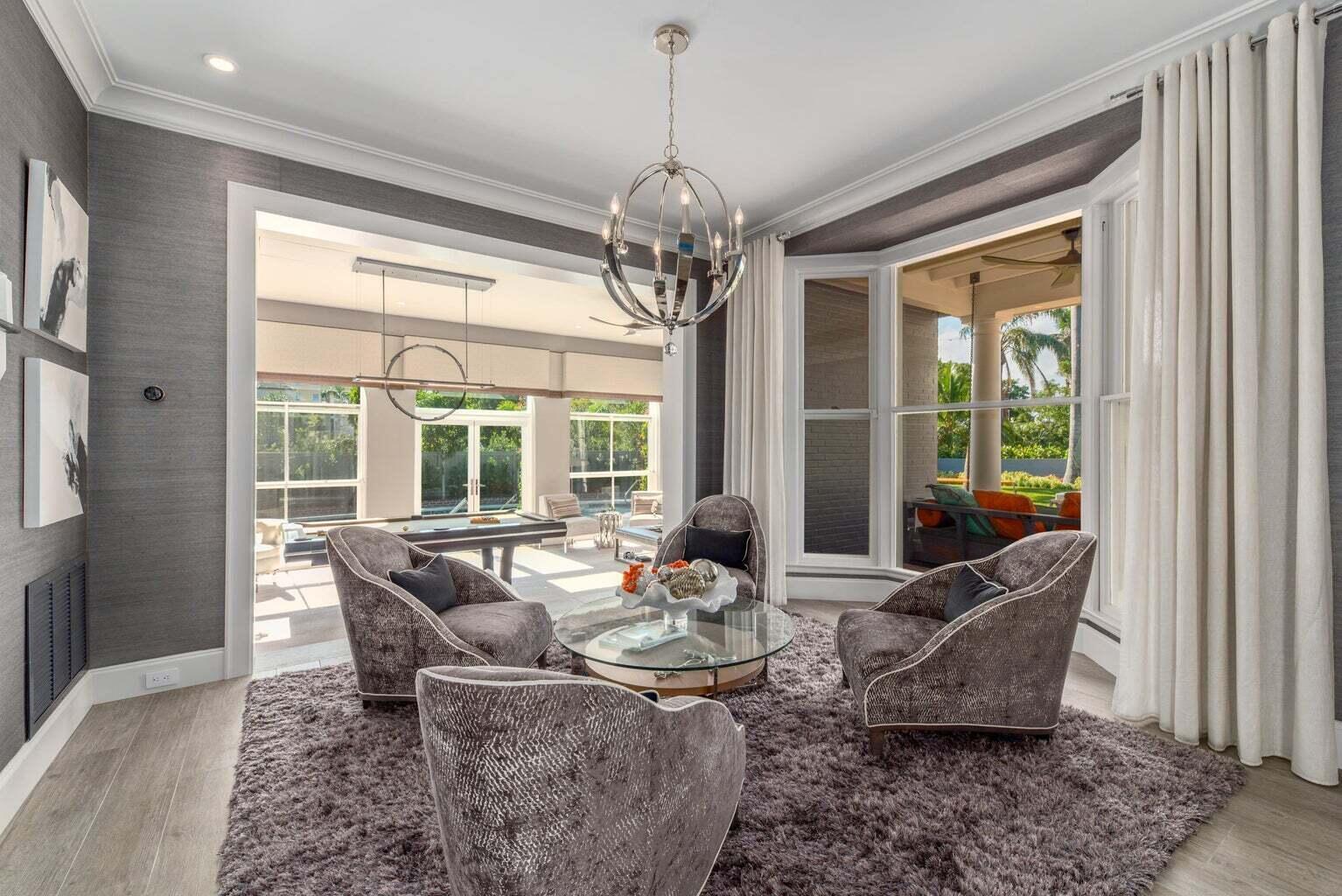 A sitting area with four grey armchairs, a glass coffee table, and a shaggy rug — 15 S Lake Trail, Palm Beach FL 33480, PALM BEACH, FL