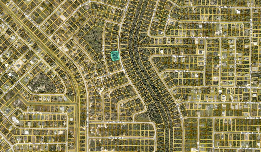This is an aerial map showing a highlighted vacant lot in a residential neighborhood — 0969062306 DELMAR DRIVE, NORTH PORT, FL