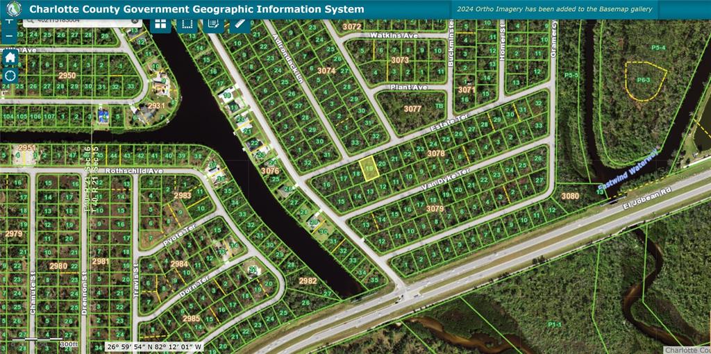 This is a satellite map showing residential lots, streets, and waterways in Charlotte County — 15163 ESTATE TERRACE, PORT CHARLOTTE, FL