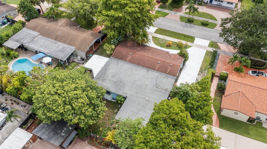 An aerial view shows a residential house with a flat roof and a swimming pool — 7311 SW 139th Ave, Miami FL 33183, MIAMI, FL