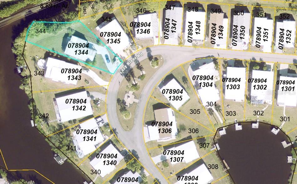 This is an aerial map showing residential lots and houses along a curved road — 151 LAZY RIVER ROAD, NORTH PORT, FL