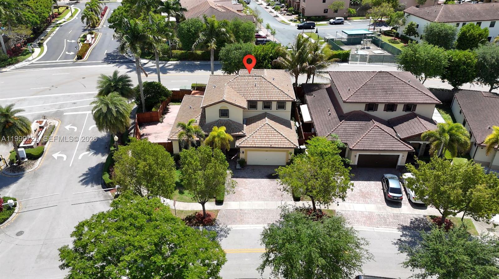 An aerial view shows a two-story suburban house with a tiled roof and paved driveway — 3698 SE 2nd Dr, Homestead FL 33033, HOMESTEAD, FL