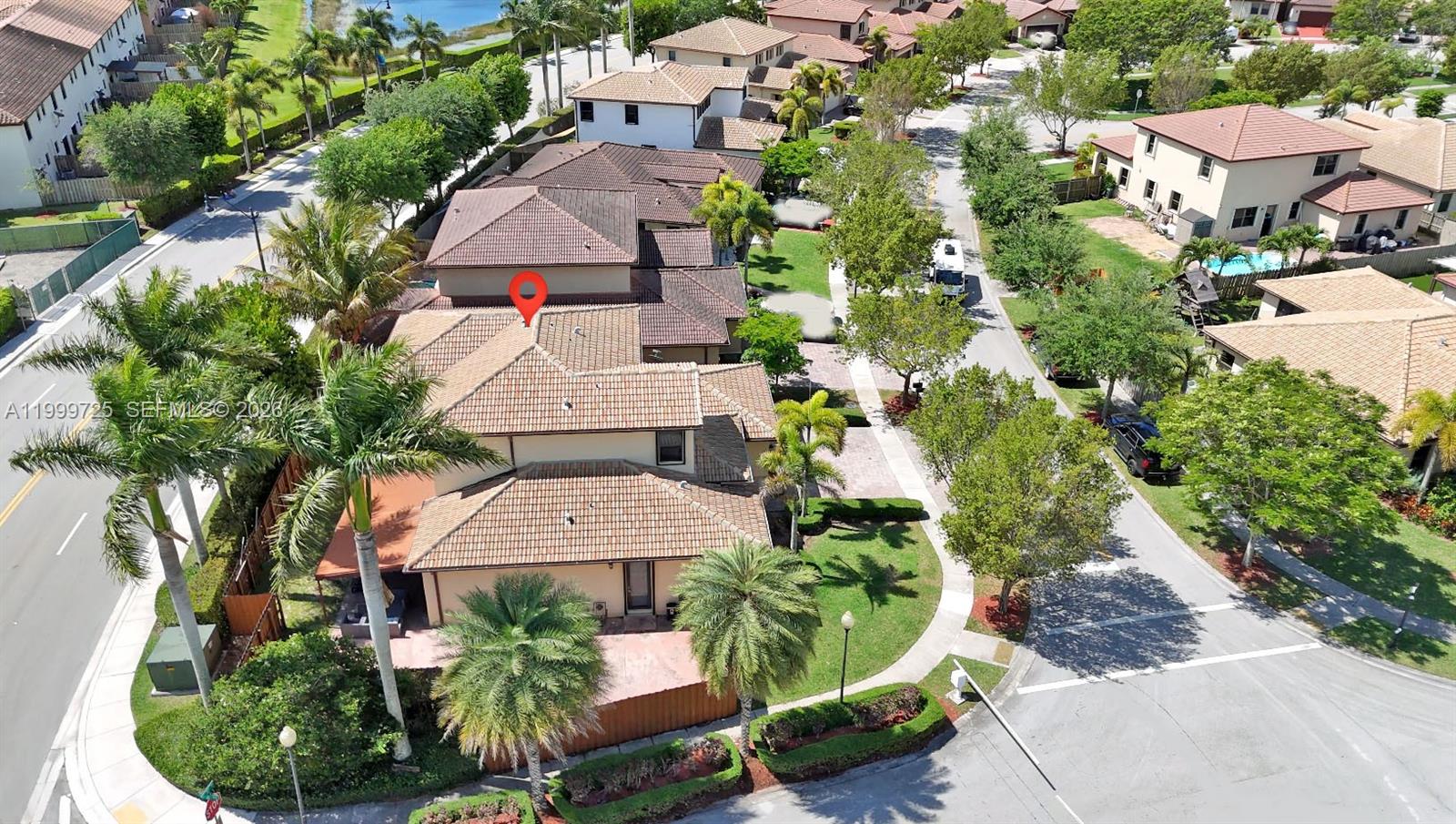 An aerial view shows a residential neighborhood with houses, palm trees, and paved streets — 3698 SE 2nd Dr, Homestead FL 33033, HOMESTEAD, FL
