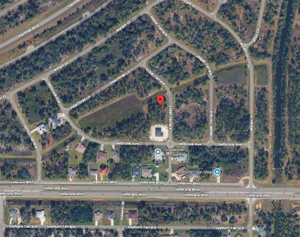 This is an aerial map showing a vacant lot marked with a red pin — Lot 3 ECKER TERRACE, NORTH PORT, FL