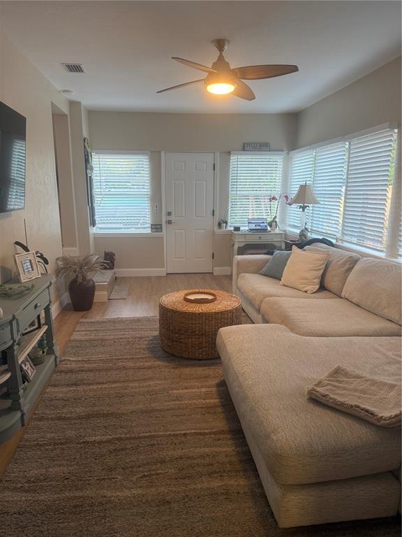 A living room features a sectional sofa, a round woven coffee table, and a ceiling fan — 2849 MARLETTE STREET, SARASOTA, FL