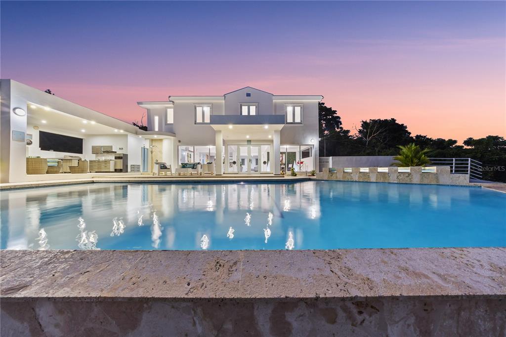 A two-story white house with a large swimming pool and an outdoor covered patio area — Bo. San Antonio Km 2.0 CARR. 739, CAGUAS, PR