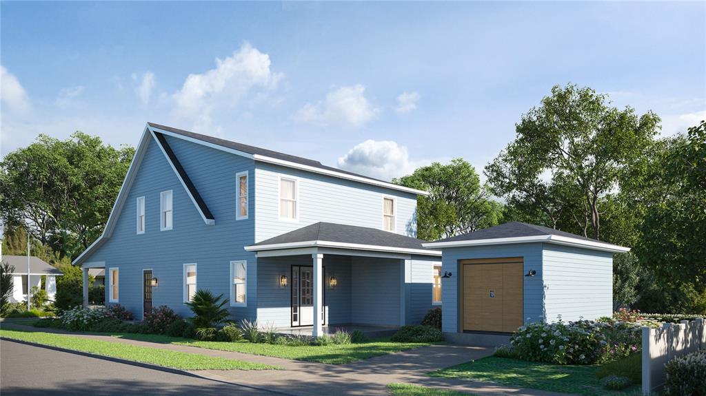 A blue two-story house with a front porch, white trim, and a shingled roof — 1224 E CHELSEA STREET, TAMPA, FL