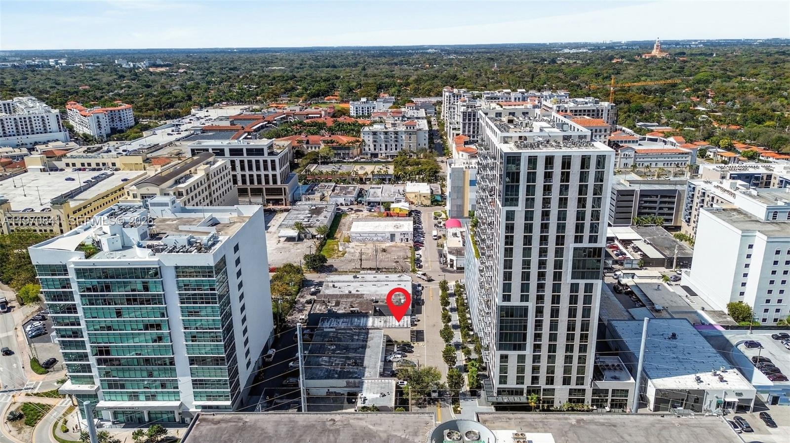 An aerial view shows a city street with a red location pin on a building — 3838 Shipping Ave, Miami FL 33146, MIAMI, FL