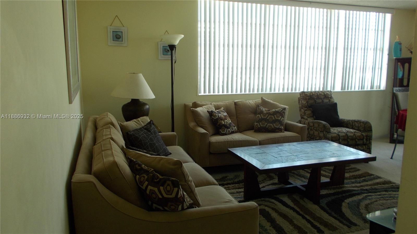 A living room features two beige sofas, a patterned armchair, and a tiled coffee table — 3161 S Ocean Dr # 505, Hallandale Beach FL 33009, HALLANDALE BEACH, FL