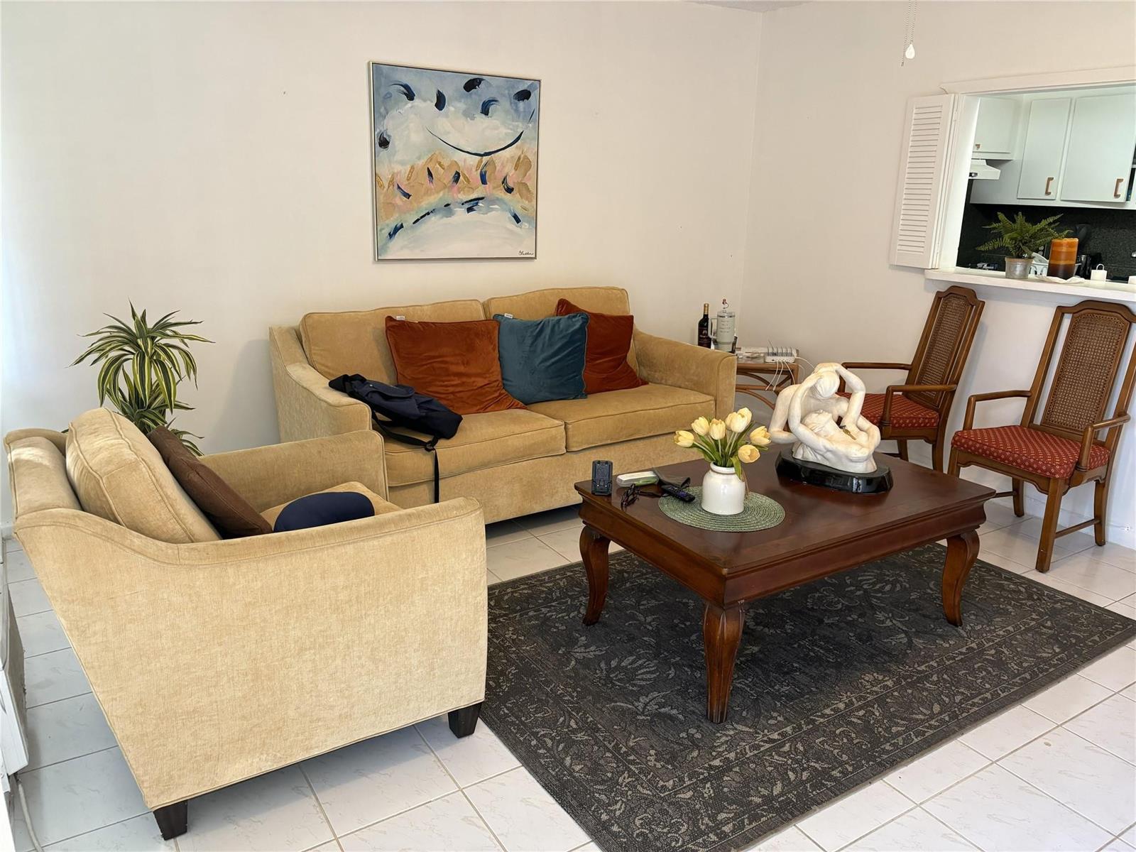 A living room features a beige sofa and armchair, a coffee table, and two chairs — 91 Preston C # 91, Boca Raton FL 33434, BOCA RATON, FL