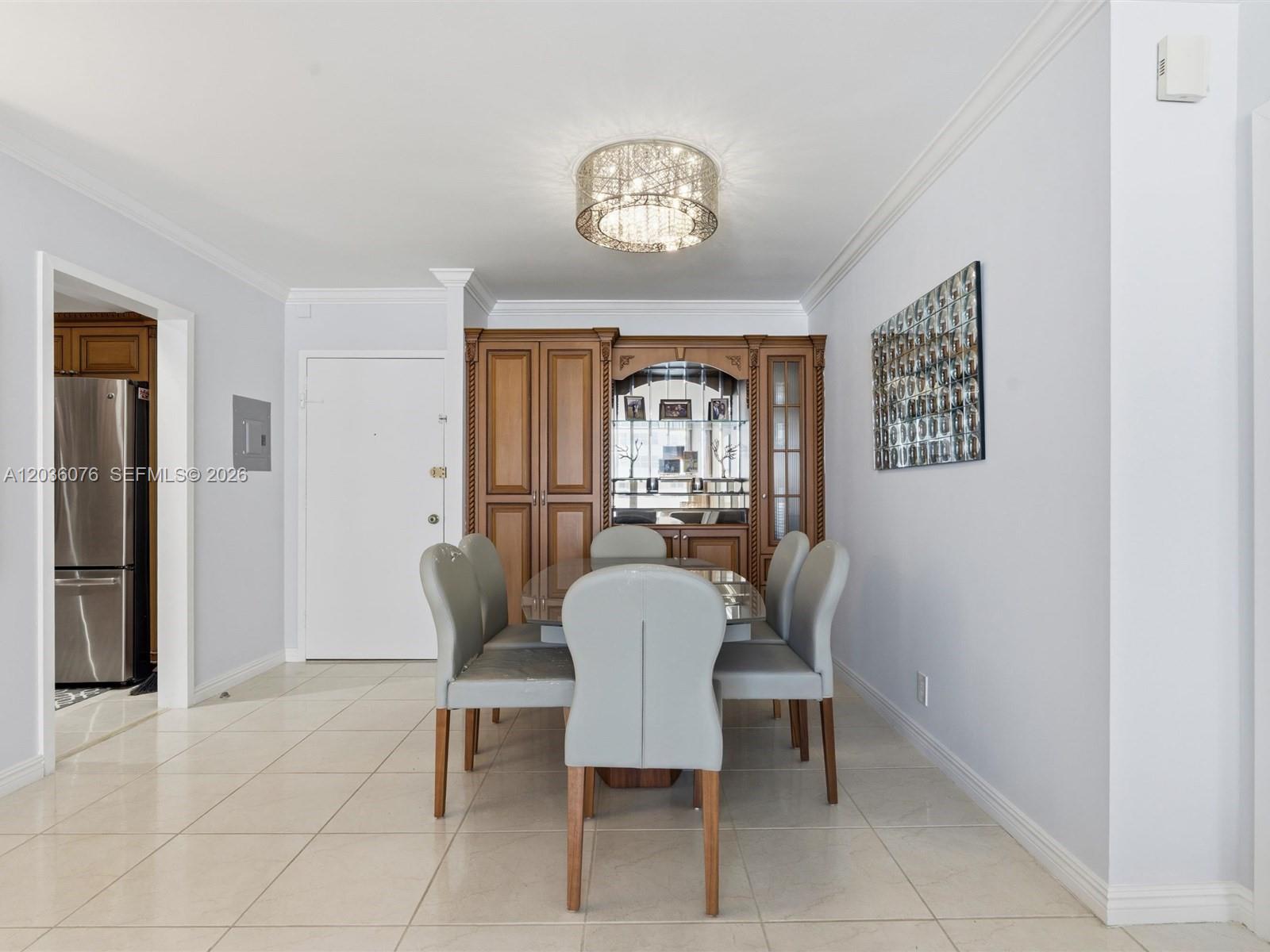 A dining room features a glass table, six grey chairs, and a wooden hutch — 2030 S Ocean Dr # 1123, Hallandale Beach FL 33009, HALLANDALE BEACH, FL