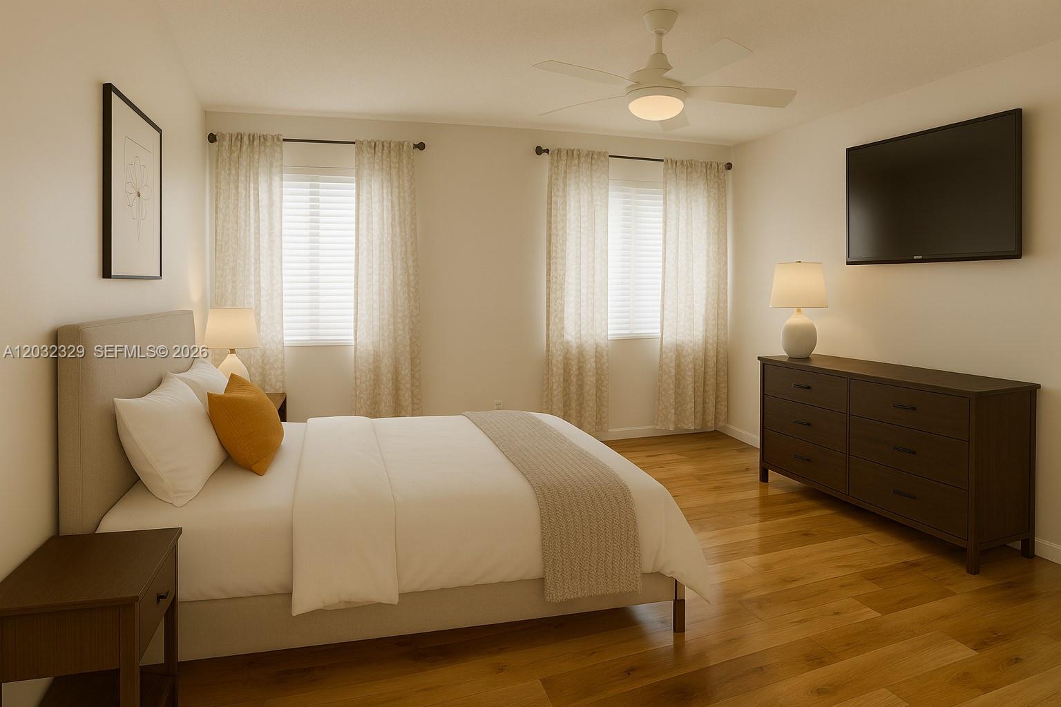 This bedroom features a bed, a dresser, two windows with curtains, and wood flooring — 125 S Laurel Dr # 506, Margate FL 33063, MARGATE, FL