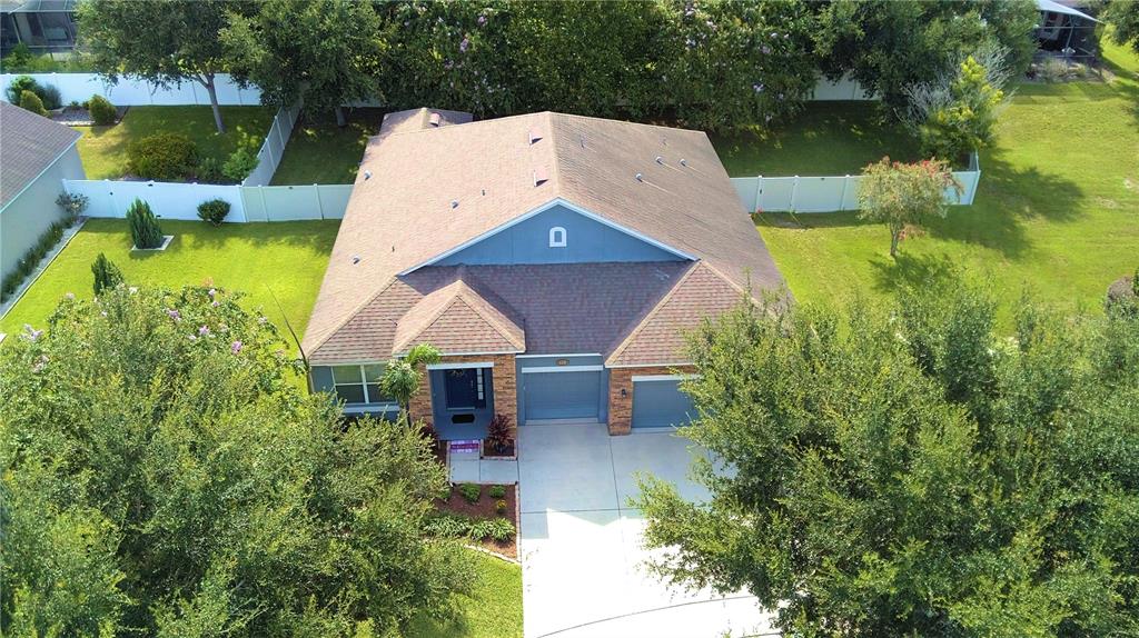 An aerial view of a single-story house with a shingled roof and two-car garage — 112 PECORRI COURT, AUBURNDALE, FL