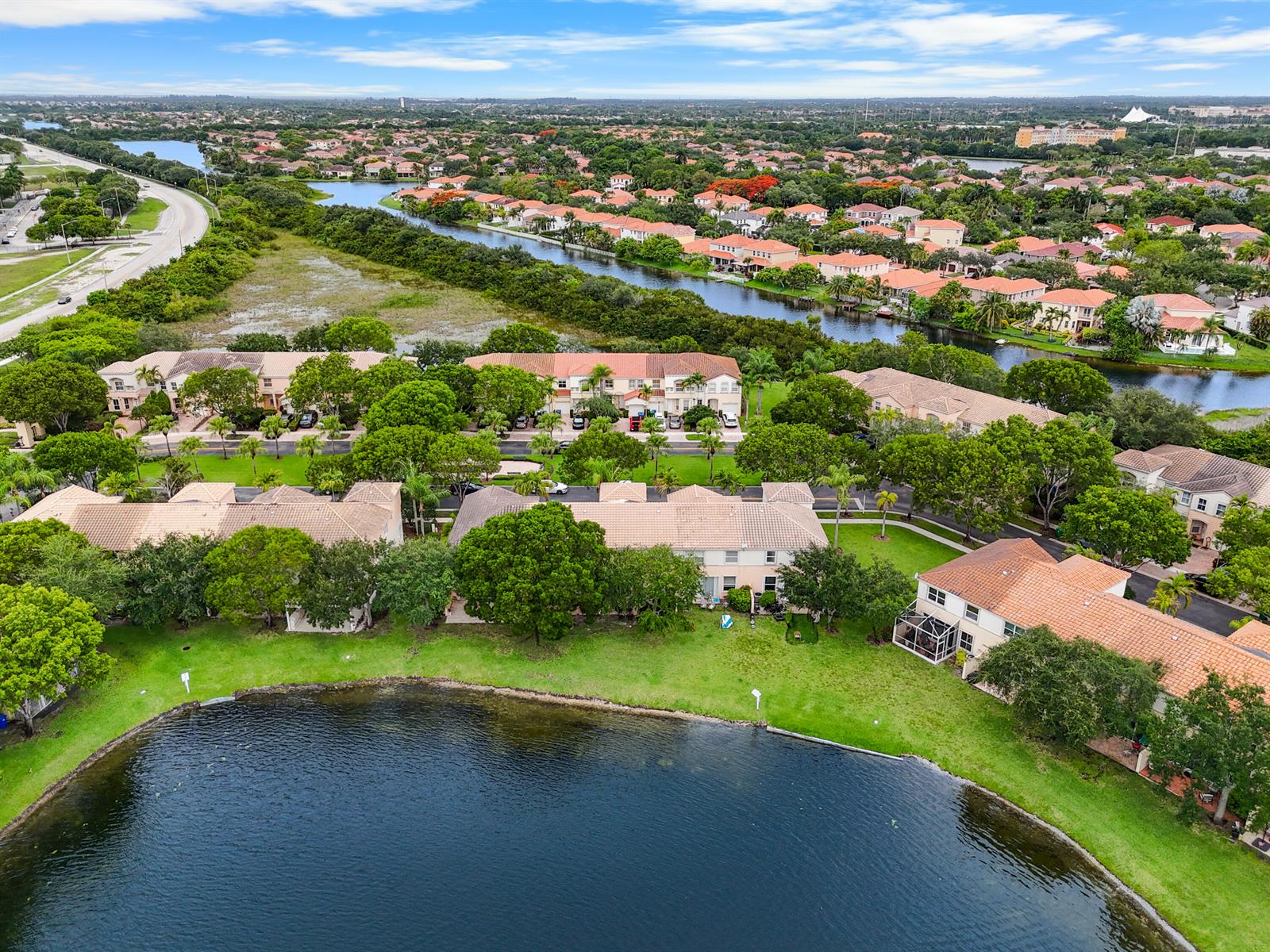 An aerial view shows a multi-unit residential building with a tiled roof and palm trees — 4735 SW 164th Avenue, Miramar FL 33027, MIRAMAR, FL