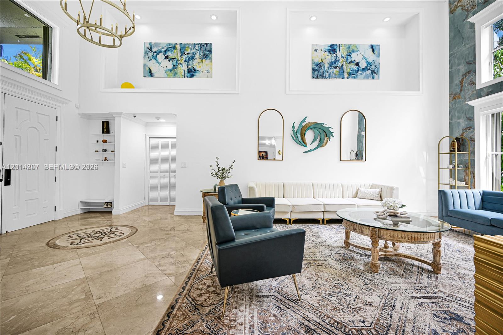 A high-ceiling living room features marble floors, a large area rug, and modern furniture — 9866 SW 111th Ter, Miami FL 33176, MIAMI, FL