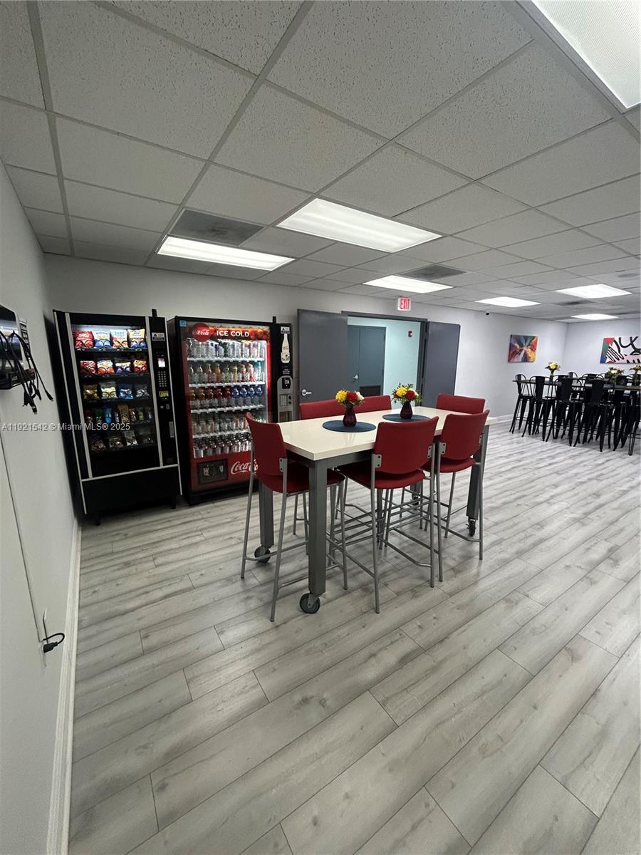 A breakroom features a snack machine, a soda vending machine, and a high-top dining table — 351 S Cypress Rd, Pompano Beach FL 33060, POMPANO BEACH, FL