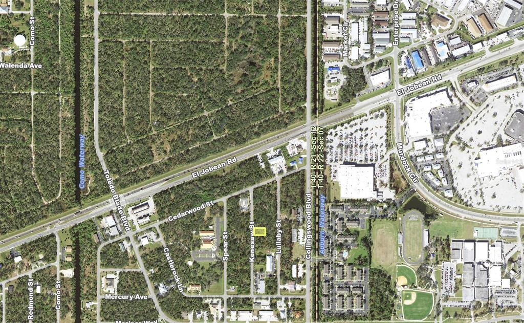 This is an aerial map showing a highlighted rectangular property lot in a residential area — 1428 KENESAW STREET, PORT CHARLOTTE, FL