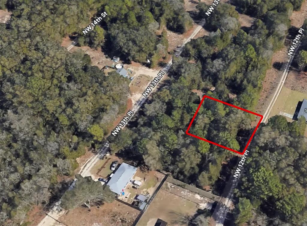 An aerial view shows a wooded, rectangular vacant lot outlined in red near a road — 5421 NW 12TH PLACE, OCALA, FL