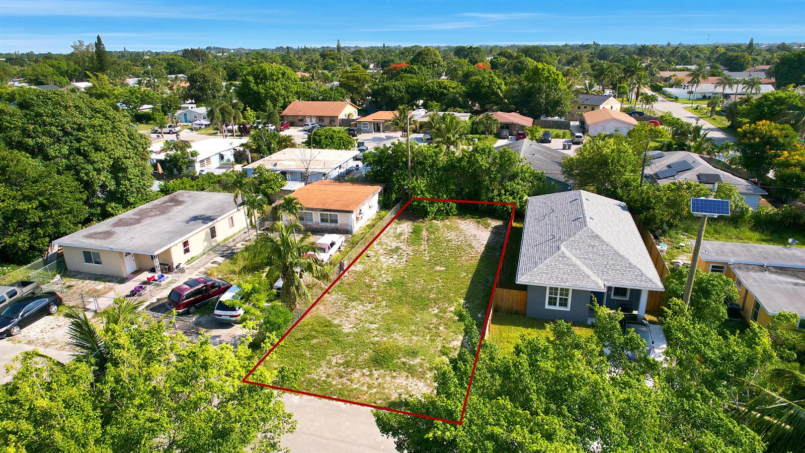An aerial view shows a vacant rectangular lot situated between two residential houses — 1141 Peak Road, Lake Worth FL 33462, LAKE WORTH, FL