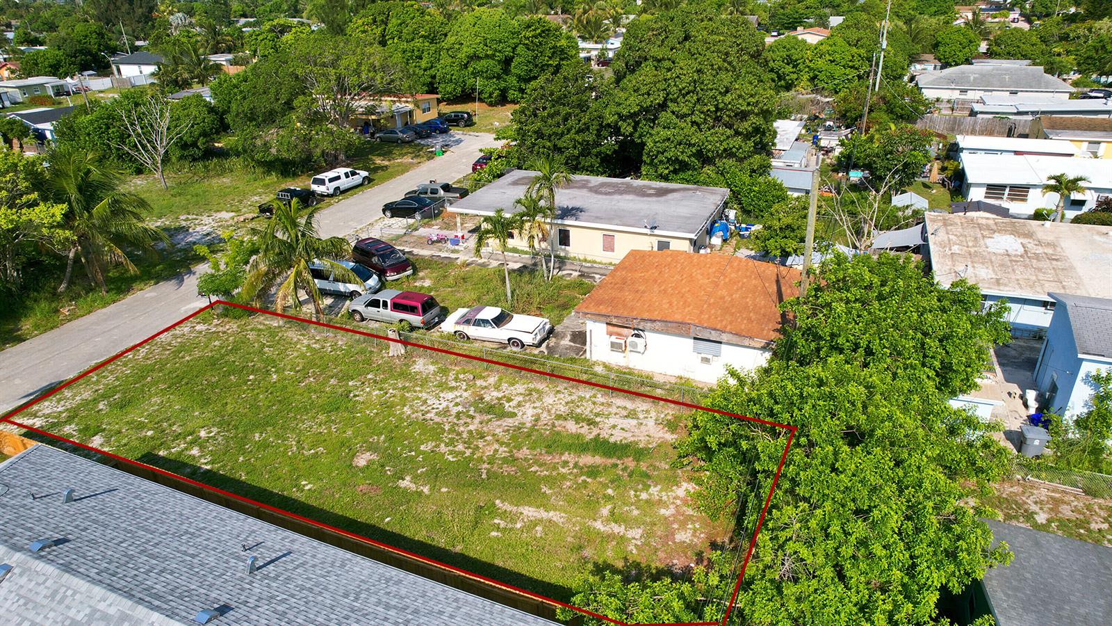 An aerial view shows a rectangular vacant lot outlined in red next to residential buildings — 1141 Peak Road, Lake Worth FL 33462, LAKE WORTH, FL