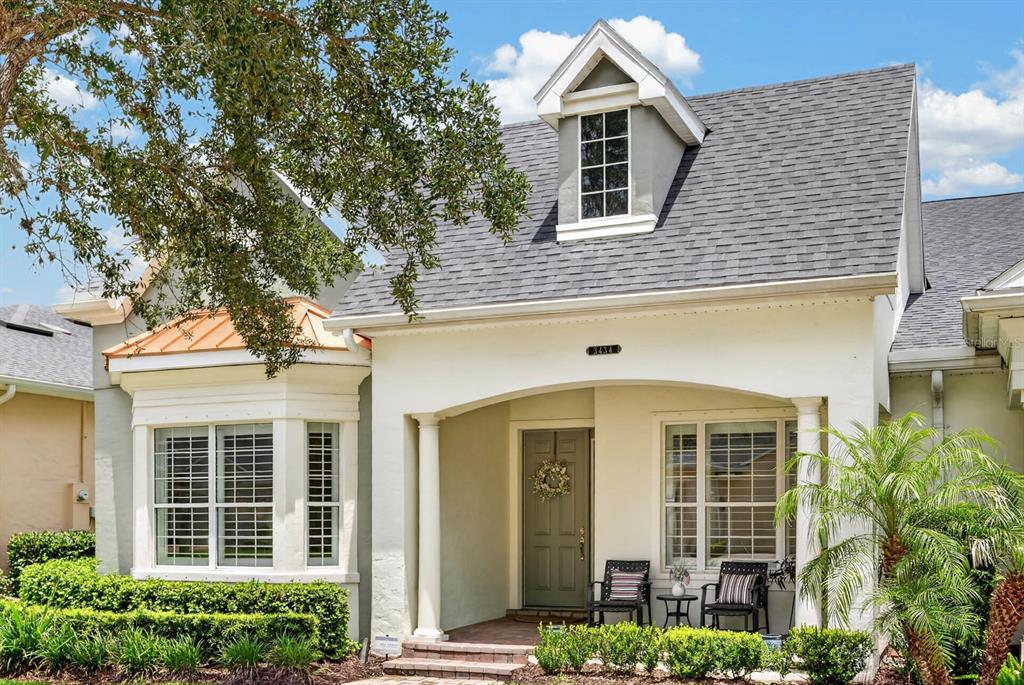 A single-story house exterior features a covered front porch, a bay window, and a dormer window — 3434 TORRE BOULEVARD, NEW SMYRNA BEACH, FL