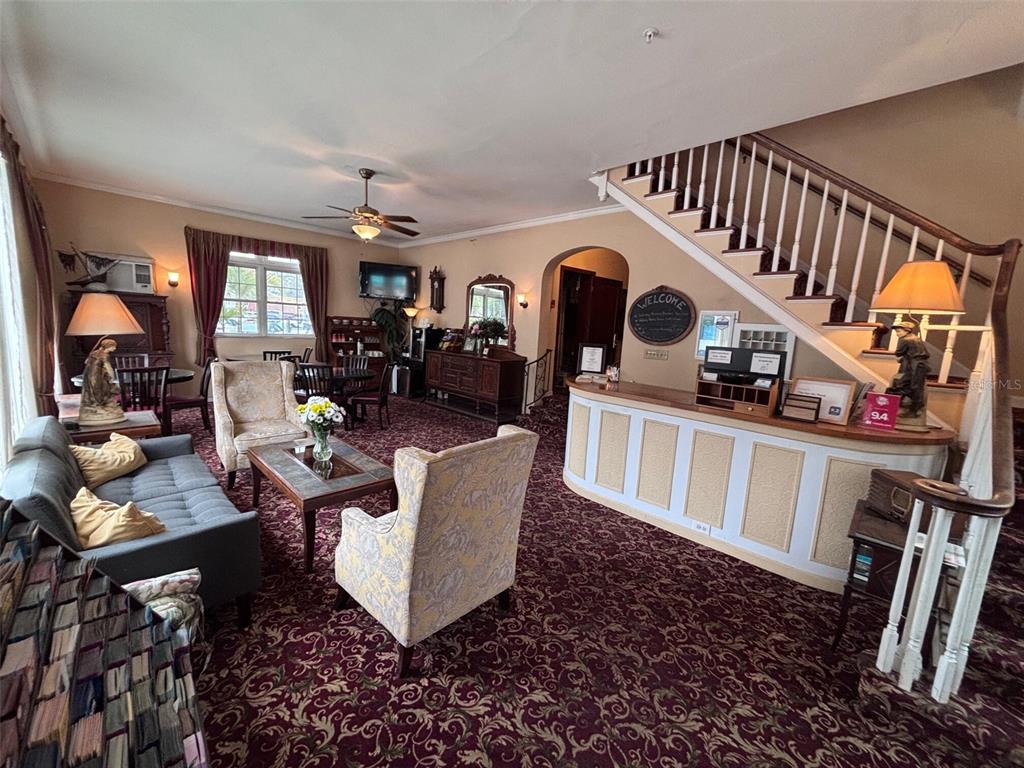A hotel lobby features a reception desk, a seating area, and a staircase — 342 3RD AVENUE N, ST PETERSBURG, FL