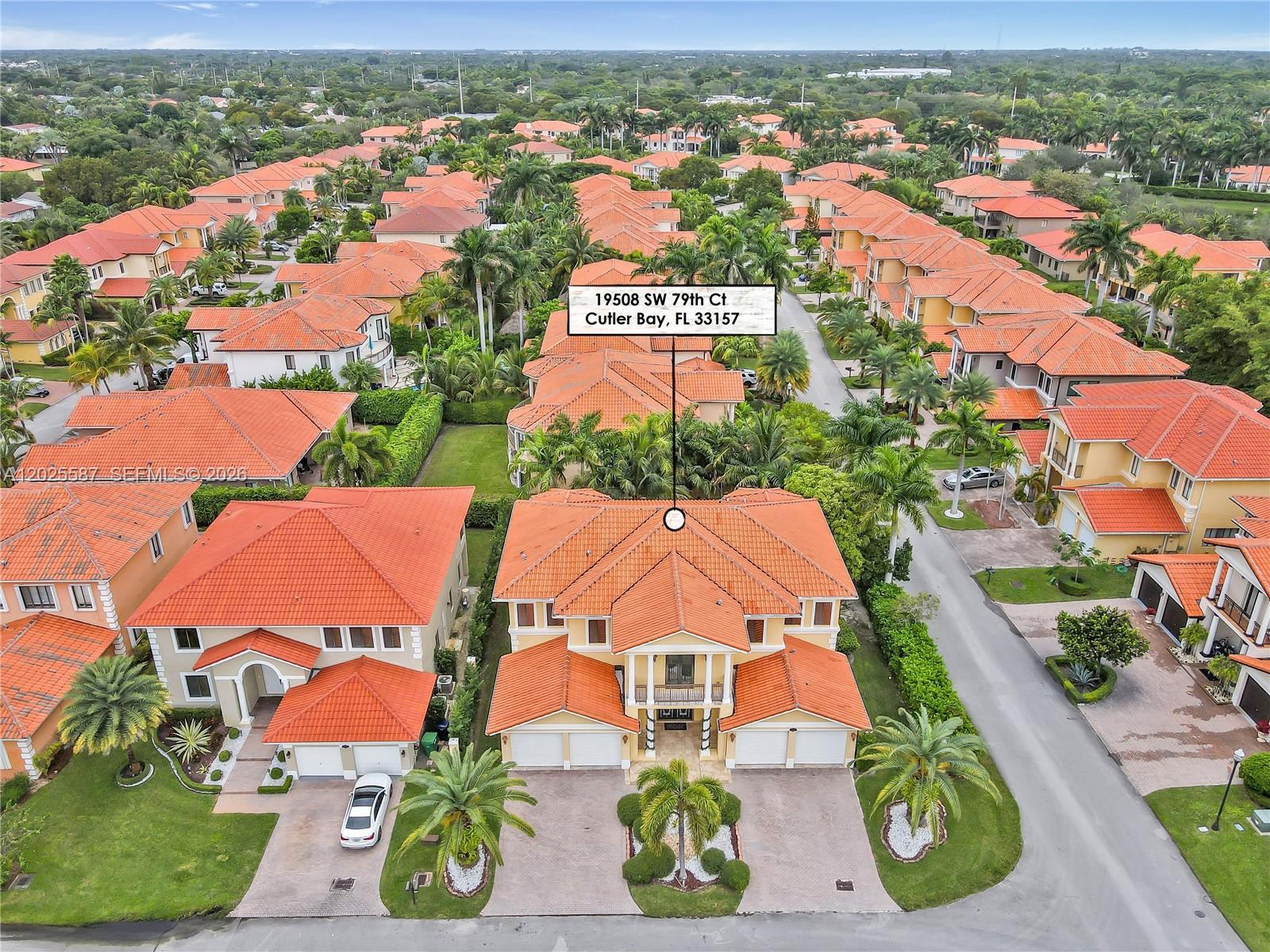 An aerial view shows a two-story house with a red tile roof and palm trees — 19508 SW 79th Ct, Cutler Bay FL 33157, CUTLER BAY, FL