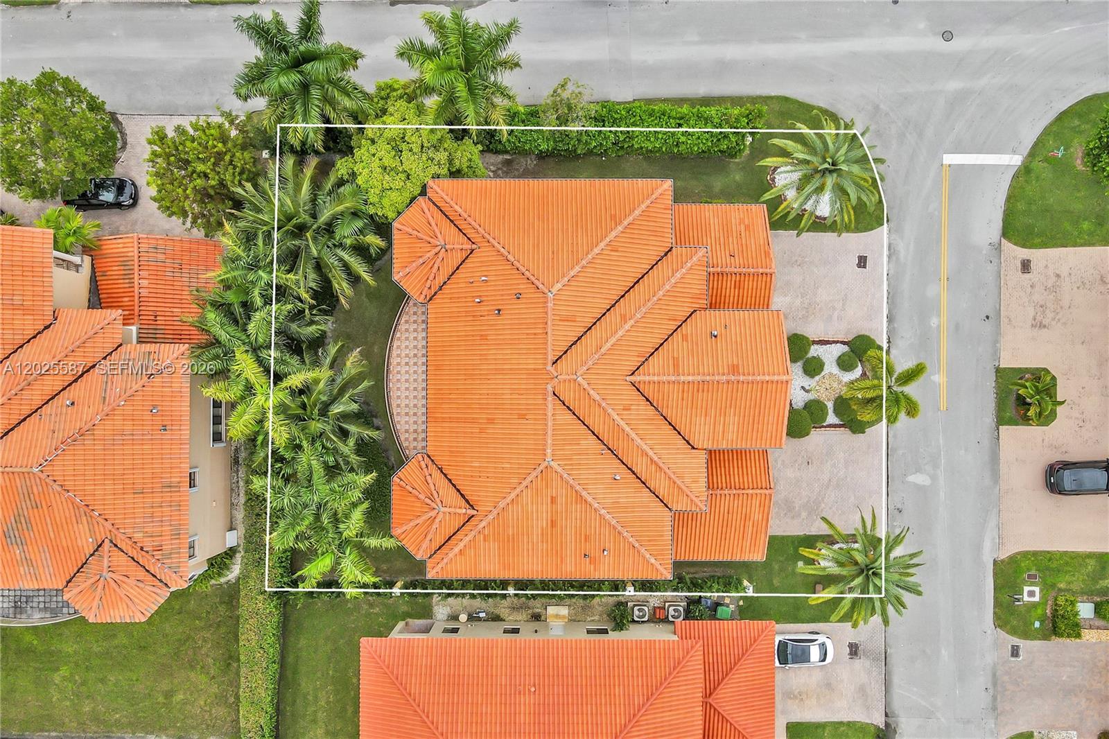 An aerial view shows a house with a terracotta tile roof surrounded by palm trees — 19508 SW 79th Ct, Cutler Bay FL 33157, CUTLER BAY, FL