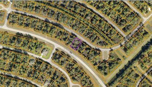 An aerial map view shows a vacant residential lot outlined in purple within a neighborhood — HAMPSHIRE CIRCLE, NORTH PORT, FL