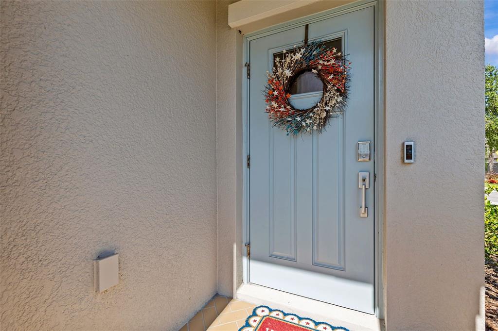 A kitchen features white cabinets, granite countertops, stainless steel appliances, and a breakfast bar — 1603 ROSEVILLE STREET, LUTZ, FL
