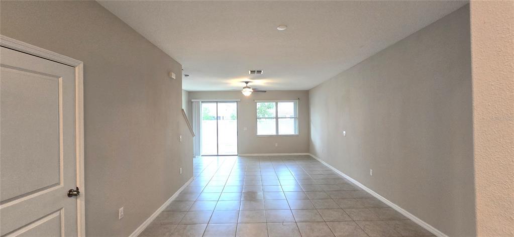 An aerial view of a multi-unit townhouse complex with attached garages and landscaped front yards — 817 ROYAL EMPRESS DRIVE, RUSKIN, FL